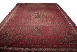 Large 20th century Caucasian wool floor rug with a large central panel decorated with geometric