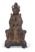Qing dynasty bronze figure of a seated immortal, 35cm high, traces of gilt decoration