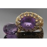 18ct gold amethyst and diamond ring, the oval faceted amethyst multi-claw set and raised above a
