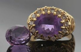 18ct gold amethyst and diamond ring, the oval faceted amethyst multi-claw set and raised above a