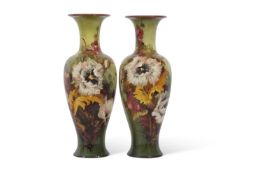 An impressive pair of Doulton Lambeth faience vases decorated with floral sprays by Isabel Lewis,