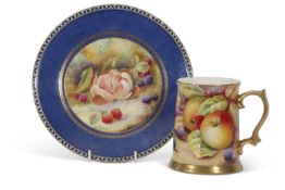 Wedgwood plate painted with fruit, signed H Holland, together with a tankard painted with fruit,