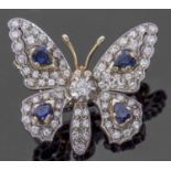 Diamond and sapphire butterfly brooch, the outstretched wings and body decorated with four pear