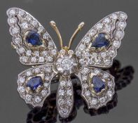 Diamond and sapphire butterfly brooch, the outstretched wings and body decorated with four pear