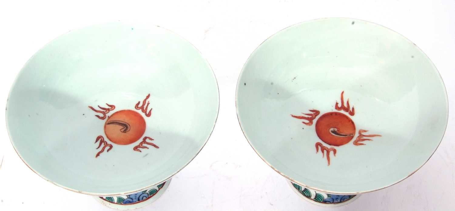 Pair of Chinese porcelain stem cups, late Qing dynasty, decorated in iron red with phoenix to the - Image 2 of 8