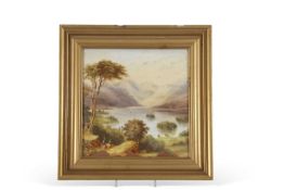 Porcelain plaque, late 19th century, painted with a mountain and lake scene, in gilt frame, 19 x