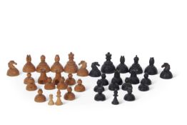 An unusual antique turned wooden and lead weighted chess set of squat form, largest piece 7cm