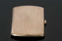 9ct gold cigarette case of shaped rectangular form with overall engraved and chased pattern