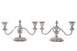 Pair of Elizabeth II squat three-light candelabra in Regency style having loaded and embossed shaped