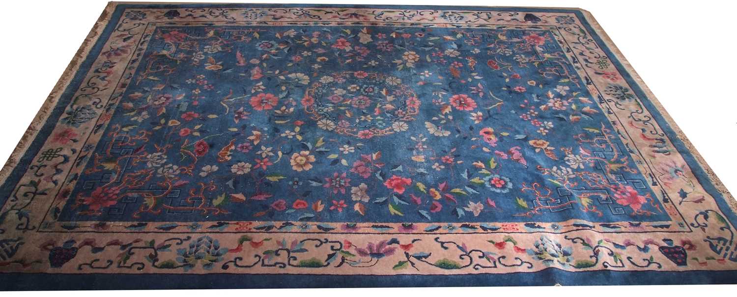 Early 20th century Peking wool carpet decorated with stylised foliage on a blue centre with a pale - Image 3 of 11