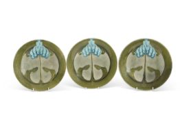 Three Secessionist Minton plates with blue and green glazes, 23cm diam (3)