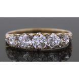Victorian five stone diamond ring featuring five graduated old round cut diamonds, highlighted