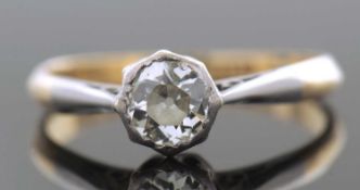 Antique diamond single stone ring featuring a old cut diamond in a rub-over setting, raised