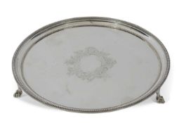 Late Victorian waiter of plain circular form with beaded edges and ornate vacant cartouche to the