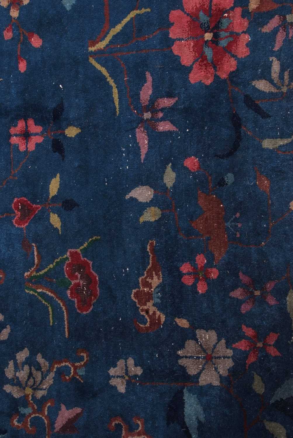 Early 20th century Peking wool carpet decorated with stylised foliage on a blue centre with a pale - Image 8 of 11