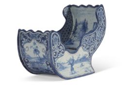 Dutch Delft Pipe Rack late 19th century modelled as a sleigh with painted decoration of winter