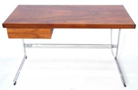 A Merrow Associates rosewood veneered and chrome framed desk with single drawer 122cm wide