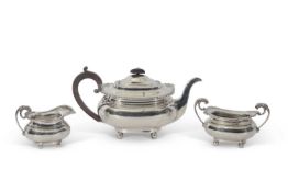 Edward VII three piece tea set of compressed oval form with shell and gadrooned edges, lions head