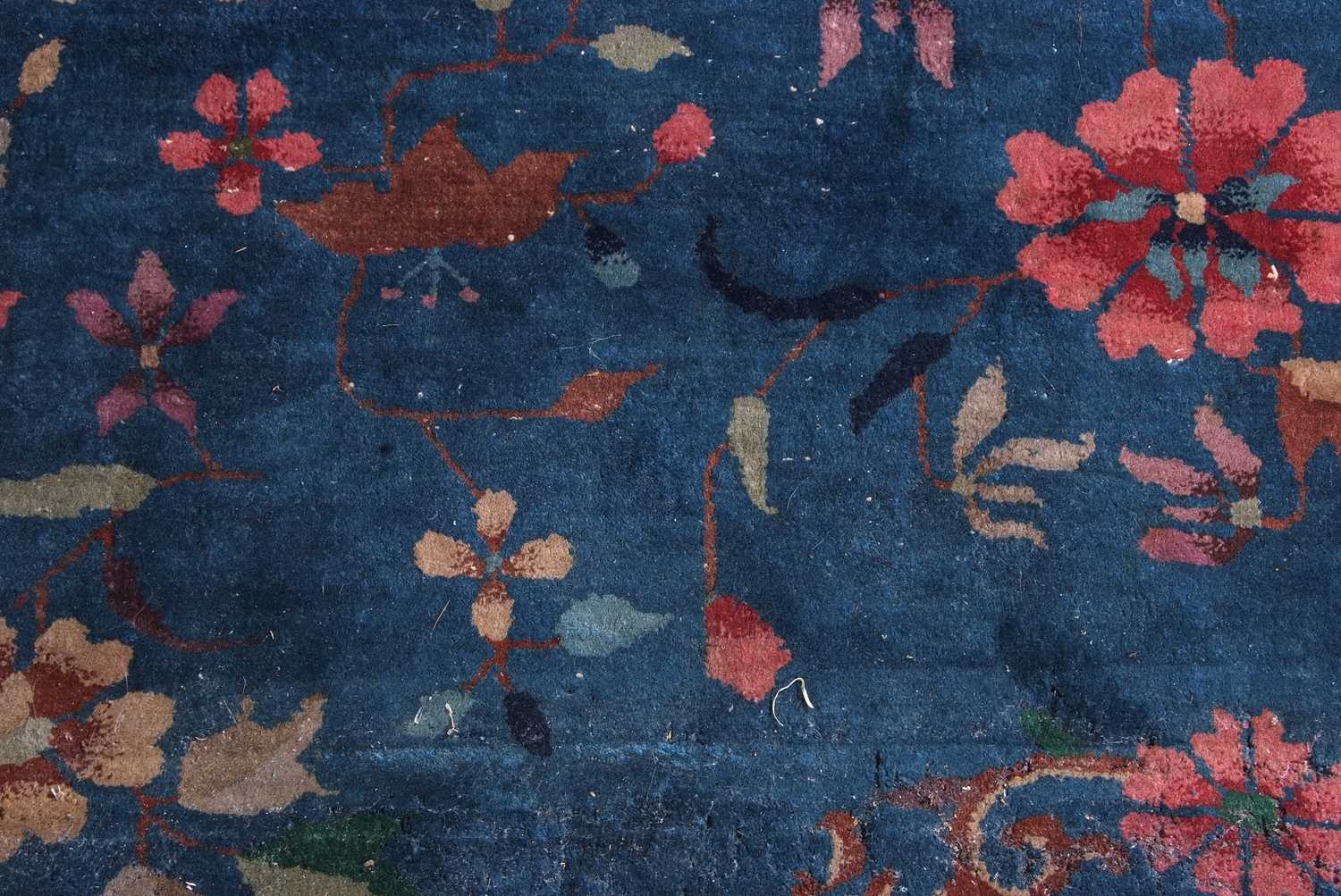 Early 20th century Peking wool carpet decorated with stylised foliage on a blue centre with a pale - Image 6 of 11