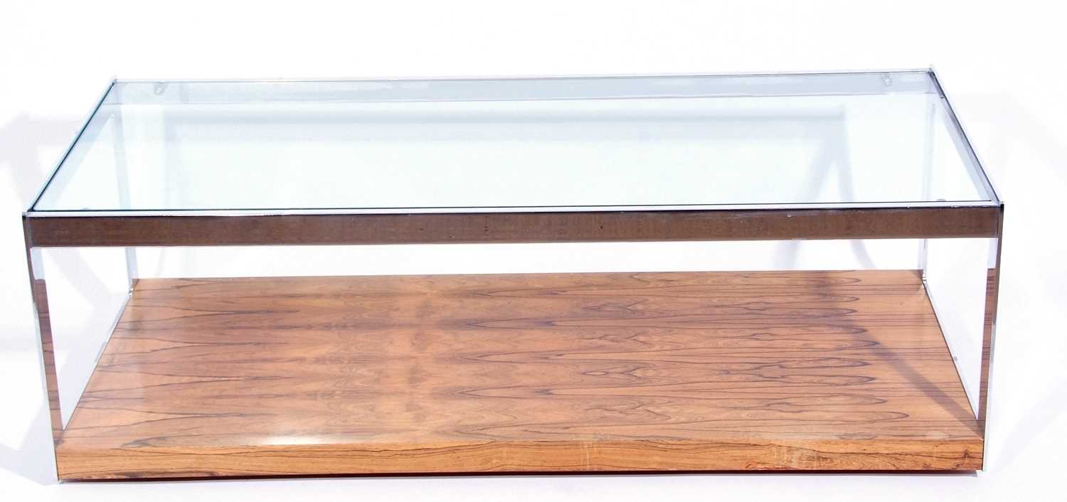 A Merrow Associates rosewood veneered chrome framed and glass topped coffee table 122cm wide