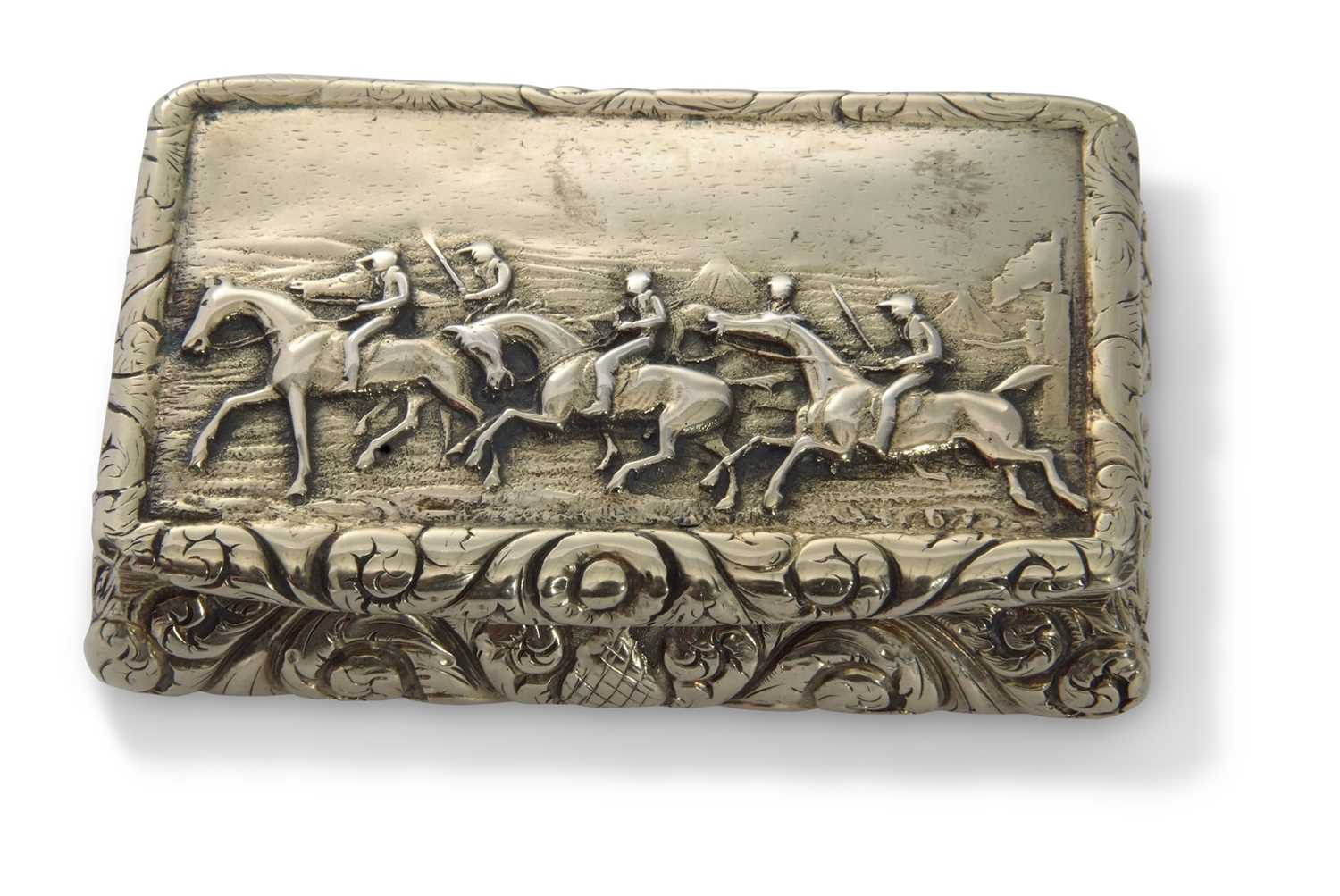 George IV heavy cast silver gilt snuff box of bombe sided rectangular form, the lid with raised