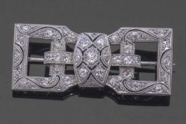 Art Deco precious metal and diamond brooch of rectangular open work shape, set throughout with