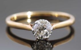 Single stone diamond ring, the old cut diamond 0.040ct approx, raised between upswept shoulders,