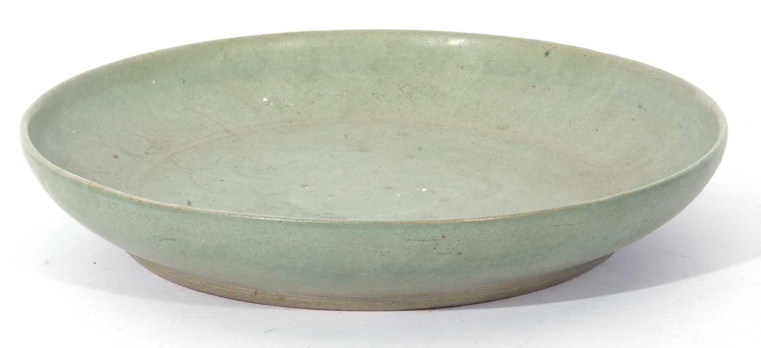 Asian green glazed pottery dish, indistinctly decorated to the centre with an elephant, 31cm diam - Image 2 of 3