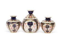 Group of Royal Crown Derby wares including a small pair of vases and further ovoid vase with Imari
