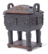 Chinese bronze censer of archaic form, relief moulded with dragon type emblems standing on four stub