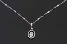 18ct white gold and diamond set pendant style necklace, the central oval cut diamond 0.70ct