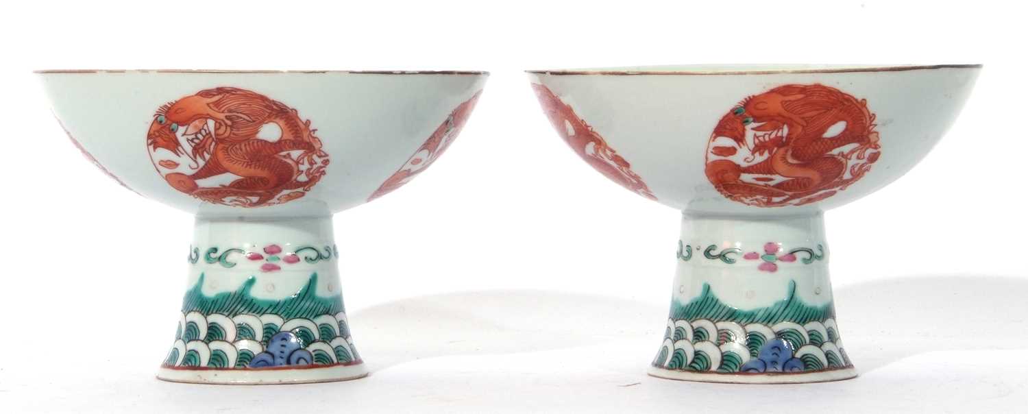 Pair of Chinese porcelain stem cups, late Qing dynasty, decorated in iron red with phoenix to the - Image 7 of 8