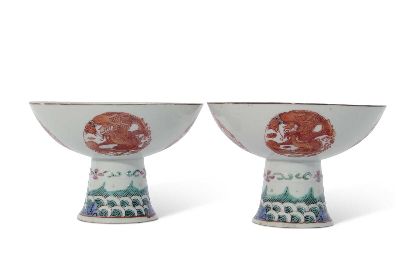 Pair of Chinese porcelain stem cups, late Qing dynasty, decorated in iron red with phoenix to the