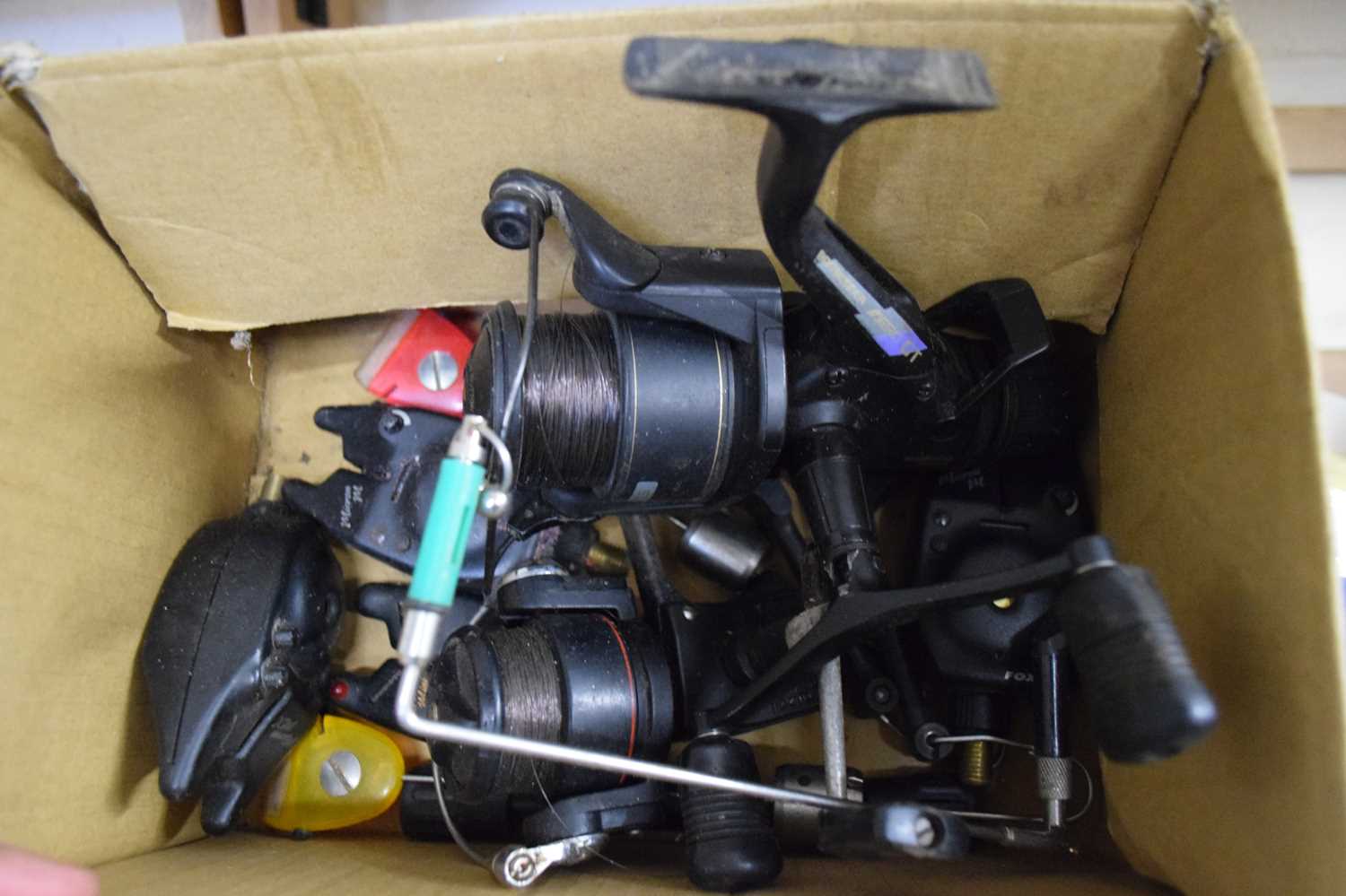 BOXED MODERN FISHING REELS, BIKE ALARM ETC