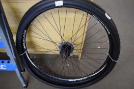 AN ACCELER8 BIKE WHEEL WITH EXTRA TYRE