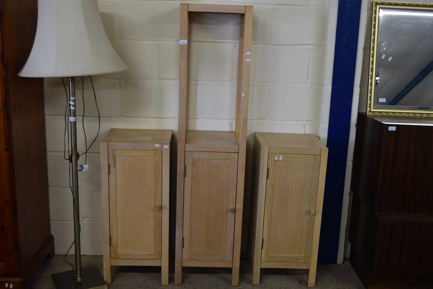 THREE MODERN LIGHT WOOD SINGLE DOOR CABINETS, ONE WITH OVER SHELF, LARGEST 160CM HIGH