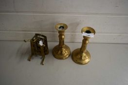 PAIR OF BRASS CANDLESTICKS TOGETHER WITH A BRASS CLOCK MOVEMENT (3)