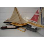 MIXED LOT COMPRISING A RADIO CONTROLLED TORPEDO BOAT PLUS TWO MODEL YACHTS AND A MODEL FISHING