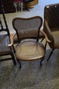CANE SEATED AND BACKED EDWARDIAN ARMCHAIR