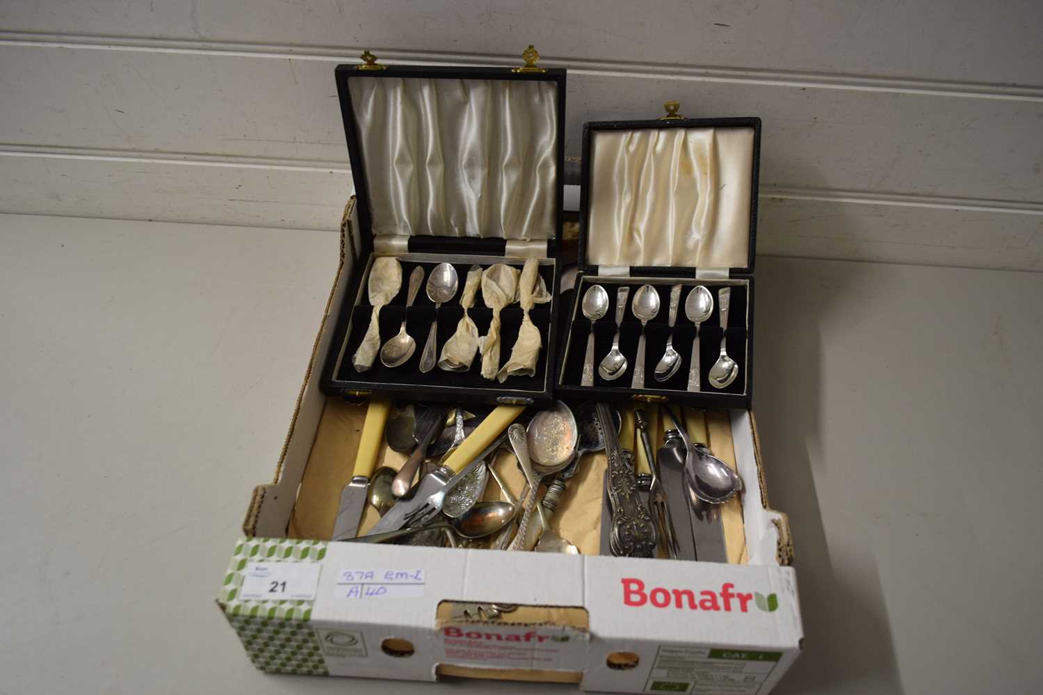 BOX CONTAINING SILVER PLATED AND STEEL CUTLERY