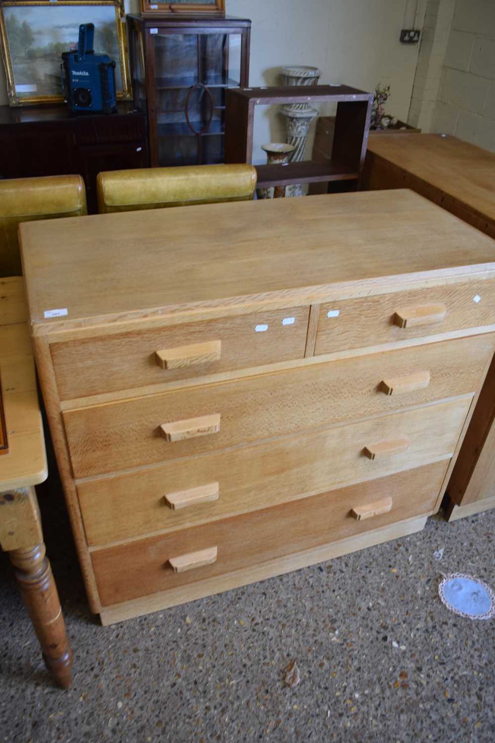 IN THE STYLE OF HEALS, MID CENTURY LIGHT OAK FIVE DRAWER CHEST WITH CUP HANDLES, 107CM WIDE