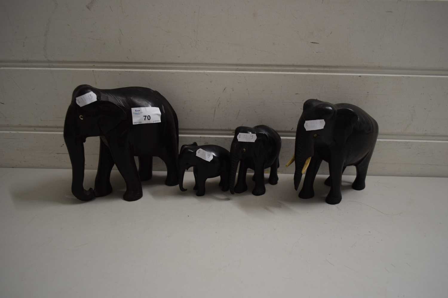 FOUR GRADUATED EBONY ELEPHANTS