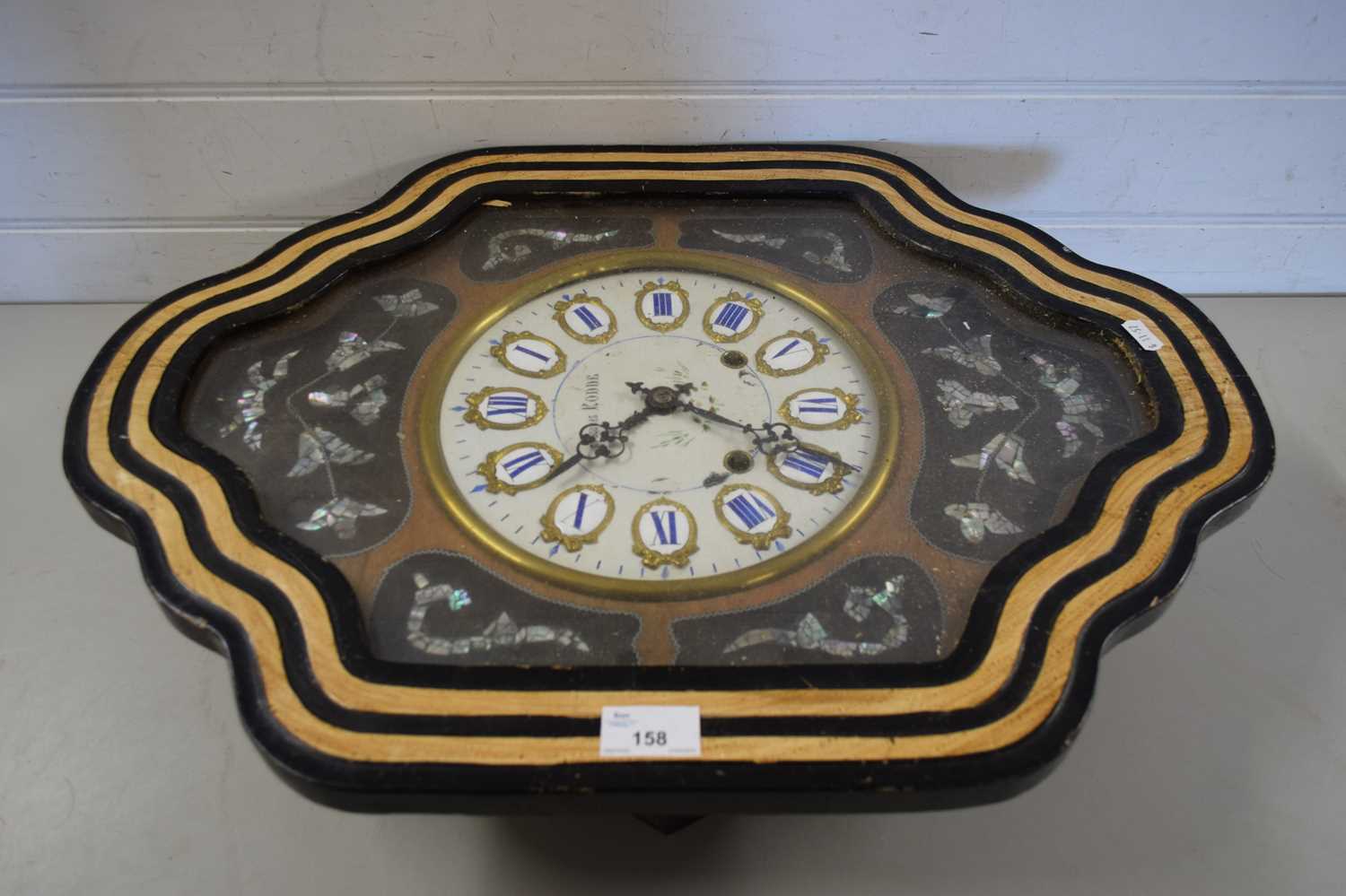 LATE 19TH CENTURY FRENCH WALL CLOCK, THE SHAPED FRAME DECORATED WITH MOTHER OF PEARL DETAIL, THE