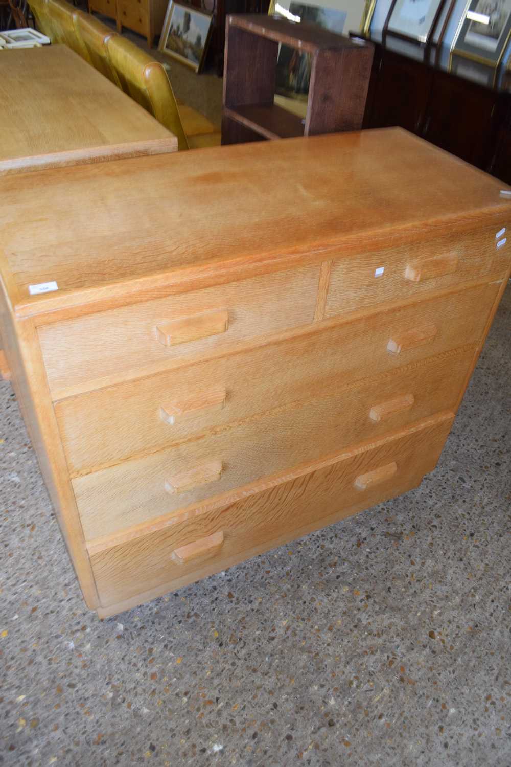 IN THE STYLE OF HEALS, MID CENTURY LIGHT OAK FIVE DRAWER CHEST WITH CUP HANDLES, 107CM WIDE