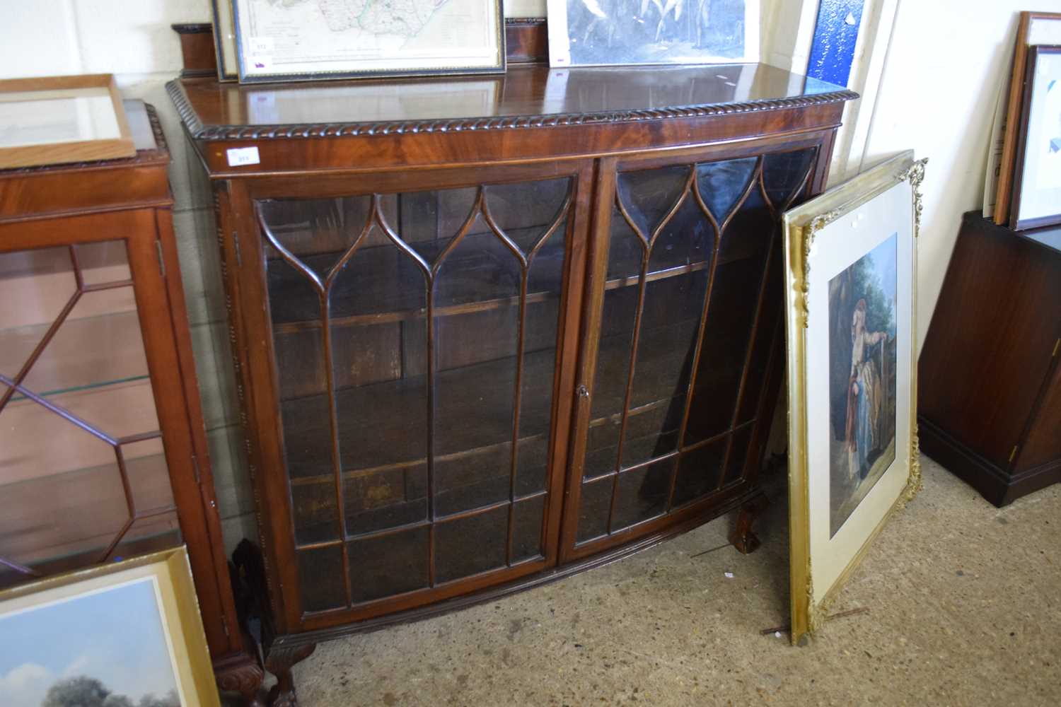 EDWARDIAN MAHOGANY BOW FRONT CHINA DISPLAY CABINET RAISED ON BALL AND CLAW FEET, 122CM WIDE