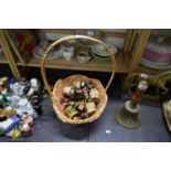 BASKET CONTAINING MINIATURE SPIRIT BOTTLES AND QUANTITY OF BISCUIT TINS