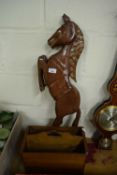 WOODEN MODEL OF A HORSE TOGETHER WITH A SMALL MAGAZINE RACK (2)