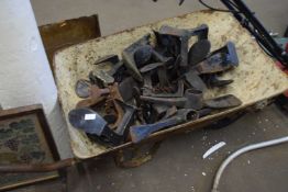 WHEELBARROW CONTAINING VARIOUS SHOE LASTS AND PICKAXE HEADS