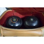 CASE CONTAINING TWO LAWN BOWLS