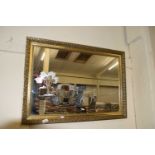 20TH CENTURY WALL MIRROR DECORATED WITH AN ETCHED DESIGN OF HORSE AND CARRIAGE, GILT FRAMED